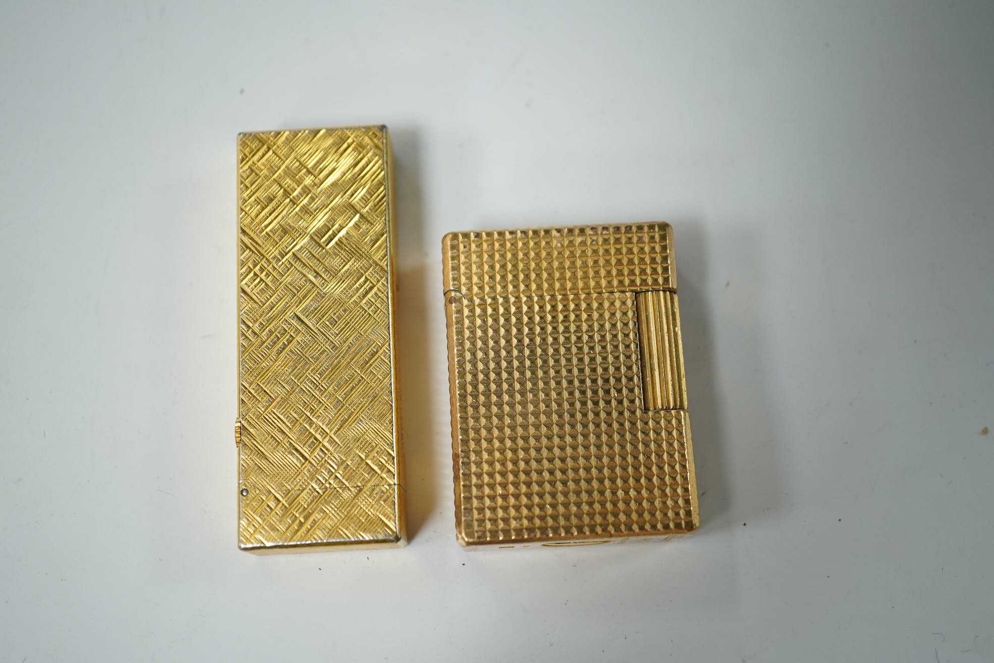 A cased DuPont lighter with booklet and a Dunhill rollagas example